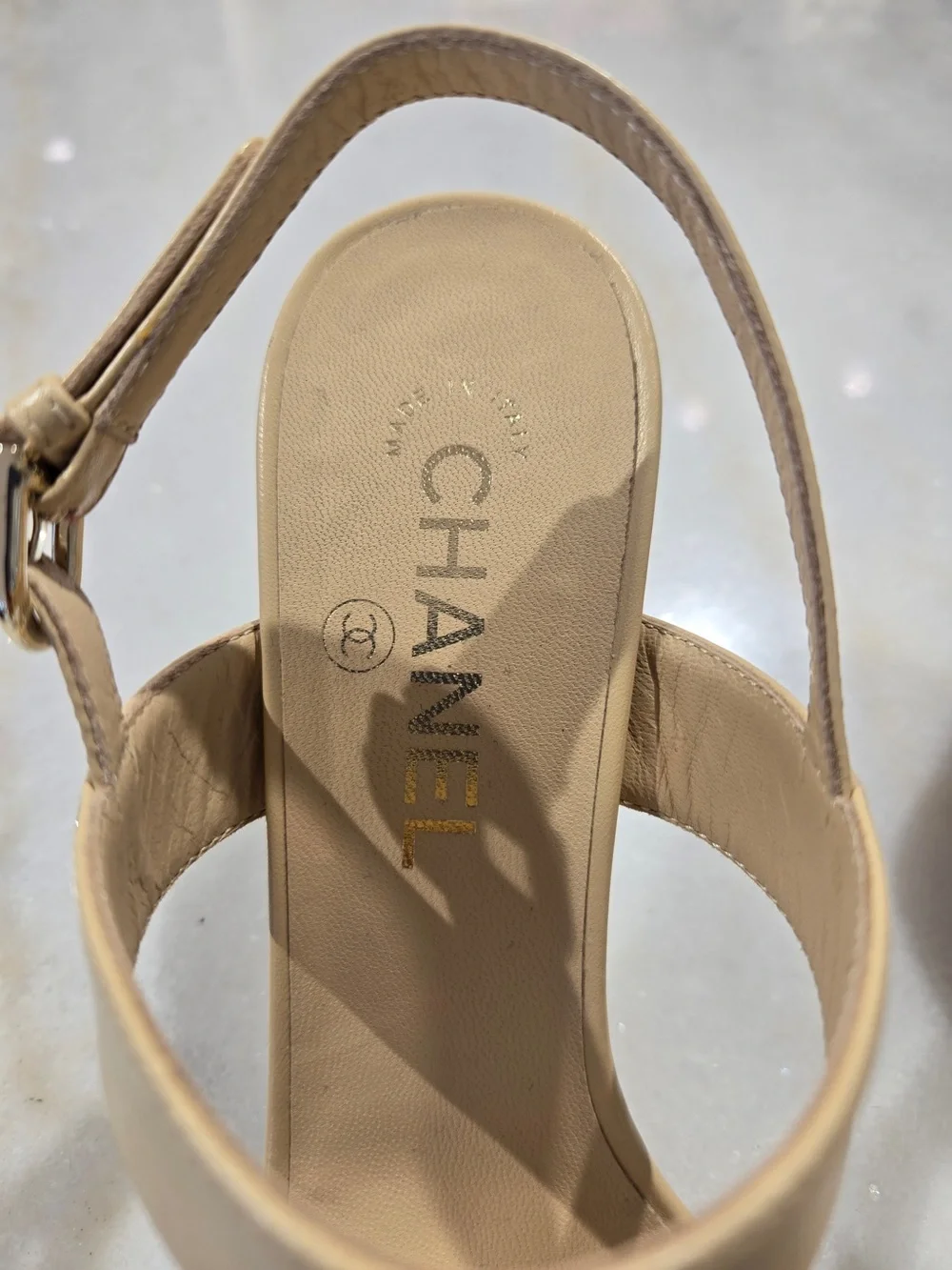 CHANEL Beige Slingback Heels with Black-and-Gold Chain